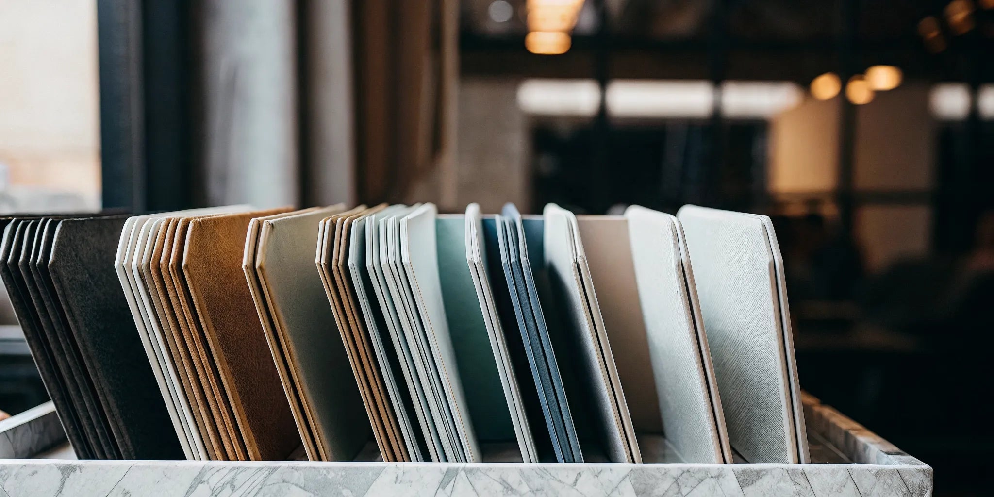 A variety of folder holders and organizers displayed in a decorative box.