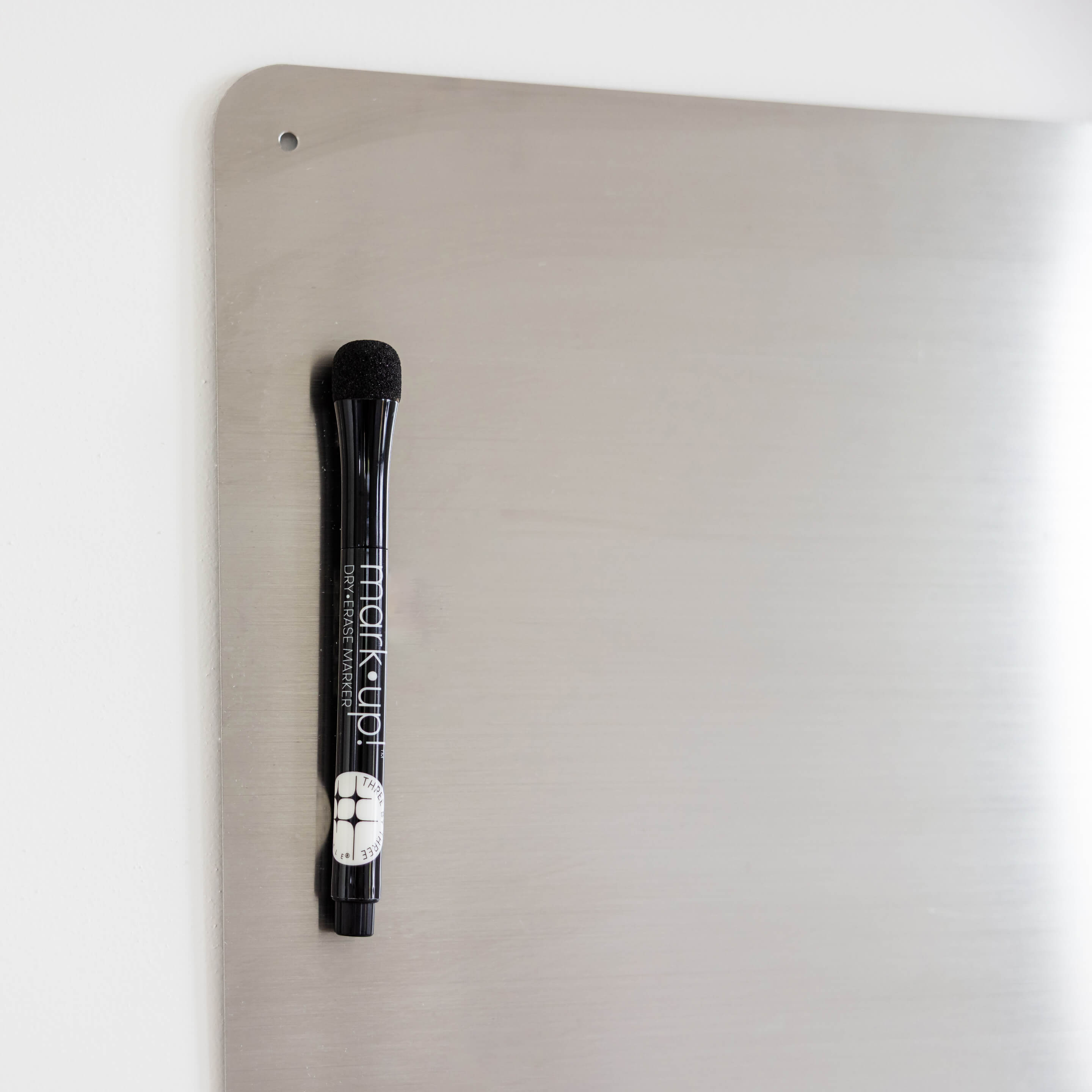 large stainless dry·erase board